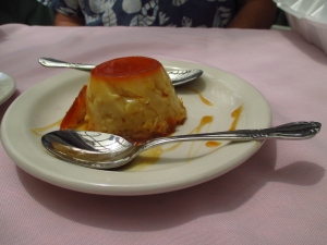 Flan at Rancho de Chimayo shown with two spoons